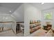 Bonus room with carpet, built-in shelves, and a comfortable sitting area perfect for reading at 627 S Chapel St, Landis, NC 28088