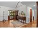 Inviting foyer with hardwood floors, elegant decor, and a glimpse of the upper level at 627 S Chapel St, Landis, NC 28088