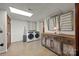 Spacious laundry room with modern washer and dryer, ample storage space, and rustic decor at 627 S Chapel St, Landis, NC 28088