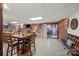 Basement Gathering room with a brick wall, dining table, and sliding glass door offering a cozy retreat at 627 S Chapel St, Landis, NC 28088