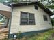 Exterior view showing the home's siding, windows, and foundation, highlighting its potential for renovation at 714 Douglas St, Shelby, NC 28150