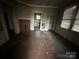 Living room featuring hardwood floors, a fireplace, and natural light coming from the window at 714 Douglas St, Shelby, NC 28150