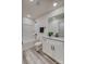 Well-lit bathroom features a modern tub-shower combo, granite countertops, and wood-look vinyl flooring at 721 32Nd Ne St, Conover, NC 28613
