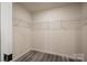 Walk-in closet with wire shelving and wood-look vinyl flooring for organized storage at 721 32Nd Ne St, Conover, NC 28613