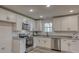 Bright kitchen featuring white cabinets, stainless steel appliances, and modern countertops at 721 32Nd Ne St, Conover, NC 28613