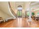 Grand foyer featuring a winding staircase, high ceilings, chandelier, and an elegant entryway at 8451 Ridgewood Rd, Sherrills Ford, NC 28673