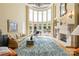 Spacious living room featuring a fireplace, large windows, and elegant furnishings for a luxurious feel at 8451 Ridgewood Rd, Sherrills Ford, NC 28673