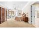 Luxurious main bedroom with sitting area, tray ceiling, and access to ensuite bathroom at 8451 Ridgewood Rd, Sherrills Ford, NC 28673