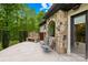 The patio area includes natural stone exterior, built-in bench, and views of the lush backyard at 8451 Ridgewood Rd, Sherrills Ford, NC 28673