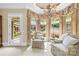 Relaxing sitting area with decorative curtains, large windows, and comfortable furnishings at 8451 Ridgewood Rd, Sherrills Ford, NC 28673