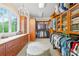 Spacious walk-in closet with custom shelving, drawers, and ample storage space for clothes and accessories at 8451 Ridgewood Rd, Sherrills Ford, NC 28673