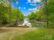 Picturesque waterfront with multiple boat docks on a tree-lined cove with a grassy shoreline at 8451 Ridgewood Rd, Sherrills Ford, NC 28673