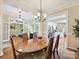 Open dining area featuring hardwood floors and views to the adjacent living room and kitchen at 9640 Alma Blount Blvd, Charlotte, NC 28277