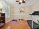 Bright workout room with hardwood floors, a treadmill, and ample natural light from the window at 9640 Alma Blount Blvd, Charlotte, NC 28277