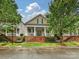 Charming two-story home with a welcoming front porch, neat landscaping and beautiful architectural details at 9640 Alma Blount Blvd, Charlotte, NC 28277