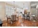 Eat-in kitchen featuring a breakfast bar, a round dining table, and stainless steel appliances at 9640 Alma Blount Blvd, Charlotte, NC 28277