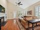 Cozy living room features a fireplace, vaulted ceiling, and a comfortable tan sofa at 9640 Alma Blount Blvd, Charlotte, NC 28277