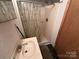 Functional bathroom featuring a shower and a simple vanity sink at 102 Eagle Ln, New London, NC 28127