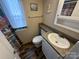 Charming bathroom featuring wood-look floors, vanity with granite-look top, and a shower with decorative curtain at 102 Eagle Ln, New London, NC 28127