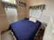 Bright bedroom with an accent wall, wood-look floors, modern window coverings and neutral paint at 102 Eagle Ln, New London, NC 28127