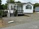 Charming home featuring white siding, a cozy porch, and well-maintained surroundings at 102 Eagle Ln, New London, NC 28127
