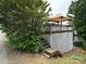 Exterior view of a deck and steps leading to a deck, partially obscured by foliage at 102 Eagle Ln, New London, NC 28127