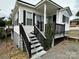 Charming home featuring a front porch, landscaped yard and a well-maintained exterior at 102 Eagle Ln, New London, NC 28127