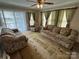 Cozy living room featuring comfortable seating, natural light, and neutral decor at 102 Eagle Ln, New London, NC 28127
