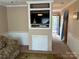 Comfortable seating area with a built-in TV and a view of the entrance at 102 Eagle Ln, New London, NC 28127
