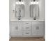 Modern bathroom featuring dual vanity with sleek black hardware and a neutral palette at 106 Walters St, Huntersville, NC 28078
