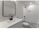 Modern bathroom featuring white subway tile, a sleek black mirror, and updated fixtures at 106 Walters St, Huntersville, NC 28078