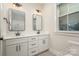 Bathroom featuring double sinks with modern fixtures and a window for natural light at 106 Walters St, Huntersville, NC 28078
