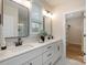 Stylish bathroom with double sink vanity, quartz countertops, and a walk-in closet at 106 Walters St, Huntersville, NC 28078