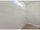 Walk-in closet featuring wire shelving and wood-look flooring at 106 Walters St, Huntersville, NC 28078