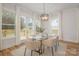 Dining area boasts natural light with views, stylish chairs, and modern light fixture at 106 Walters St, Huntersville, NC 28078