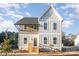 Charming two-story home featuring a modern exterior, inviting entrance, and well-manicured front lawn at 106 Walters St, Huntersville, NC 28078
