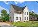 Beautiful two-story home with white siding, well-maintained lawn, and a large driveway at 106 Walters St, Huntersville, NC 28078