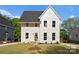 Charming two-story home with white siding and a well-manicured lawn at 106 Walters St, Huntersville, NC 28078