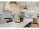 Stylish kitchen island featuring stainless steel appliances and modern pendant lighting at 106 Walters St, Huntersville, NC 28078