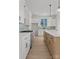 Spacious kitchen featuring a large island, stainless steel appliances, and white cabinets at 106 Walters St, Huntersville, NC 28078