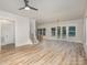 Open-concept living area with hardwood floors, large windows, and access to the backyard, perfect for entertaining at 106 Walters St, Huntersville, NC 28078