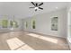 Spacious living room area with an exit door that allows plenty of natural light at 106 Walters St, Huntersville, NC 28078