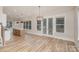 Open floor plan showing kitchen island and door to a deck from the living room with lots of windows at 106 Walters St, Huntersville, NC 28078