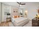 Beautiful bedroom with luxury vinyl flooring, ceiling fan, and ensuite bathroom at 106 Walters St, Huntersville, NC 28078