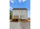 Back of house featuring a wooden deck, staircase, and a well-maintained yard with AC units at 106 Walters St, Huntersville, NC 28078