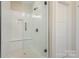 New shower with glass door, tiled walls, and modern fixtures at 106 Walters St, Huntersville, NC 28078