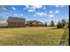 Large backyard features a brick home with a detached garage and plenty of open space at 107 Cedar Lake Dr, Statesville, NC 28625