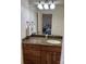 Bathroom featuring granite countertop vanity, decorative lighting, and large mirror at 107 Cedar Lake Dr, Statesville, NC 28625