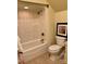 Cozy bathroom featuring a shower-tub combination and tiled flooring at 107 Cedar Lake Dr, Statesville, NC 28625