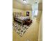 Bright carpeted bedroom with bed, colorful comforter, wood trunk, and cozy window seat at 107 Cedar Lake Dr, Statesville, NC 28625